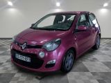 a picture of a pink car parked in a garage