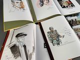 a lot of drawings on the pages of a book