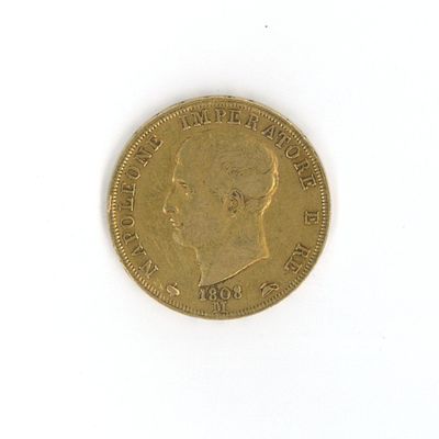 a gold coin with a picture of a man on it