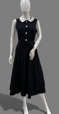 black dress on mannequin with buttons and collared neckline