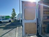 a white van that is parked in a parking lot