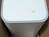 a white box with a computer in it sitting in a box
