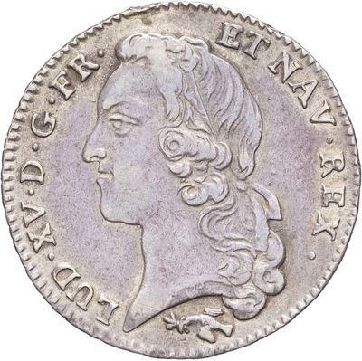 gros plan d'une pièce de monnaie sur laquelle figure un visage de femme