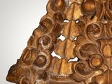 an image of a wooden sculpture of a man with a hat on
