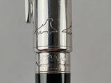 an image of a fountain pen with a signature on it
