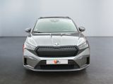 the front view of a silver car in a showroom