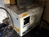 a dirty oven sitting in the corner of a room