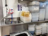 a kitchen with a lot of dishes on the shelves