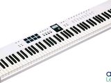 a close up of a keyboard on a white surface