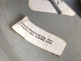 a close up of a piece of paper on a toilet seat