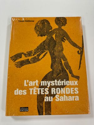 the cover of the book l ' art mysterieuux des tes rondes au sahara