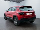 the rear end of a red suv parked in a garage