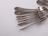 a lot of spoons that are sitting on a table