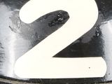 a close up of the number two on a parking meter
