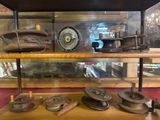 a display case with a variety of antique items