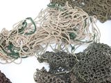 many different types of fishing nets on a white surface