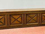 a wooden bench with a wooden top on the floor