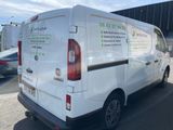 a white van that is parked in a parking lot