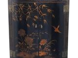 a black cabinet with flowers and birds painted on it