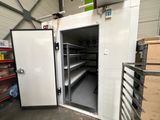 a freezer that is open in a warehouse