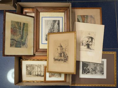 a lot of framed pictures on the floor of this room