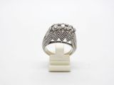 a close up of a ring on a white surface