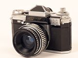 a black and white photo of a camera on a white background