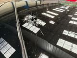 a broken window on the roof of a car