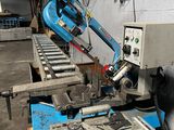 a machine that is working on a piece of metal