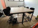 a room with a table and chairs in it