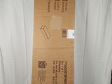 a cardboard box sitting on top of a white sheet