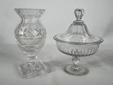 two glass vases and a glass bowl on a white surface