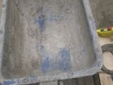 a large metal tub sitting on a pallet in the middle of the floor