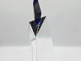 a glass sculpture of a bird on top of a clear base