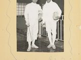 an old black and white photo of two men standing next to each other