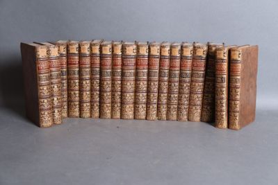 a group of old books stacked on top of each other