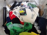 a pile of clothes and other items in a plastic bag