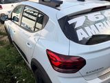 many cars parked in a parking lot with signs on the back of them