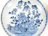 two plates with blue and white designs on them