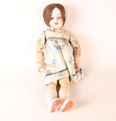 Poupée tête en porcelaine yeux riboulantcorps en composition…