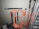 an image of a garage with tools and tools on the floor