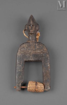 a wooden figurine of a man holding a piece of wood