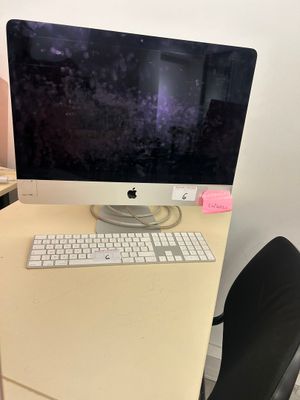 a computer on a desk with a keyboard and mouse