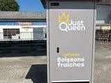 an image of a gas station with a sign that says just queen