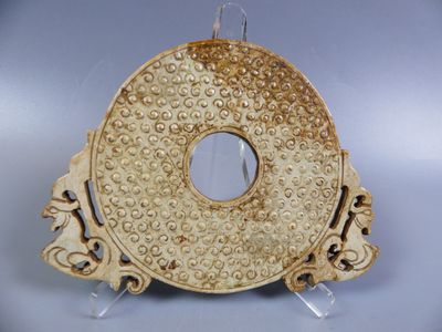 a gold plate with a circular design on it