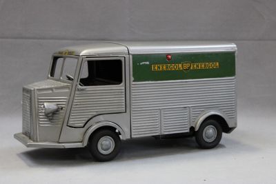 a toy truck that is sitting on a white surface