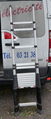 a van that has a ladder in the back of it