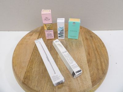 a wooden tray with a toothbrush, toothpaste, toothpaste, and toothpaste paste on it