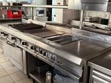 a large kitchen with stainless steel appliances in it
