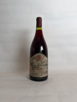 a bottle of wine that is sitting on a table
